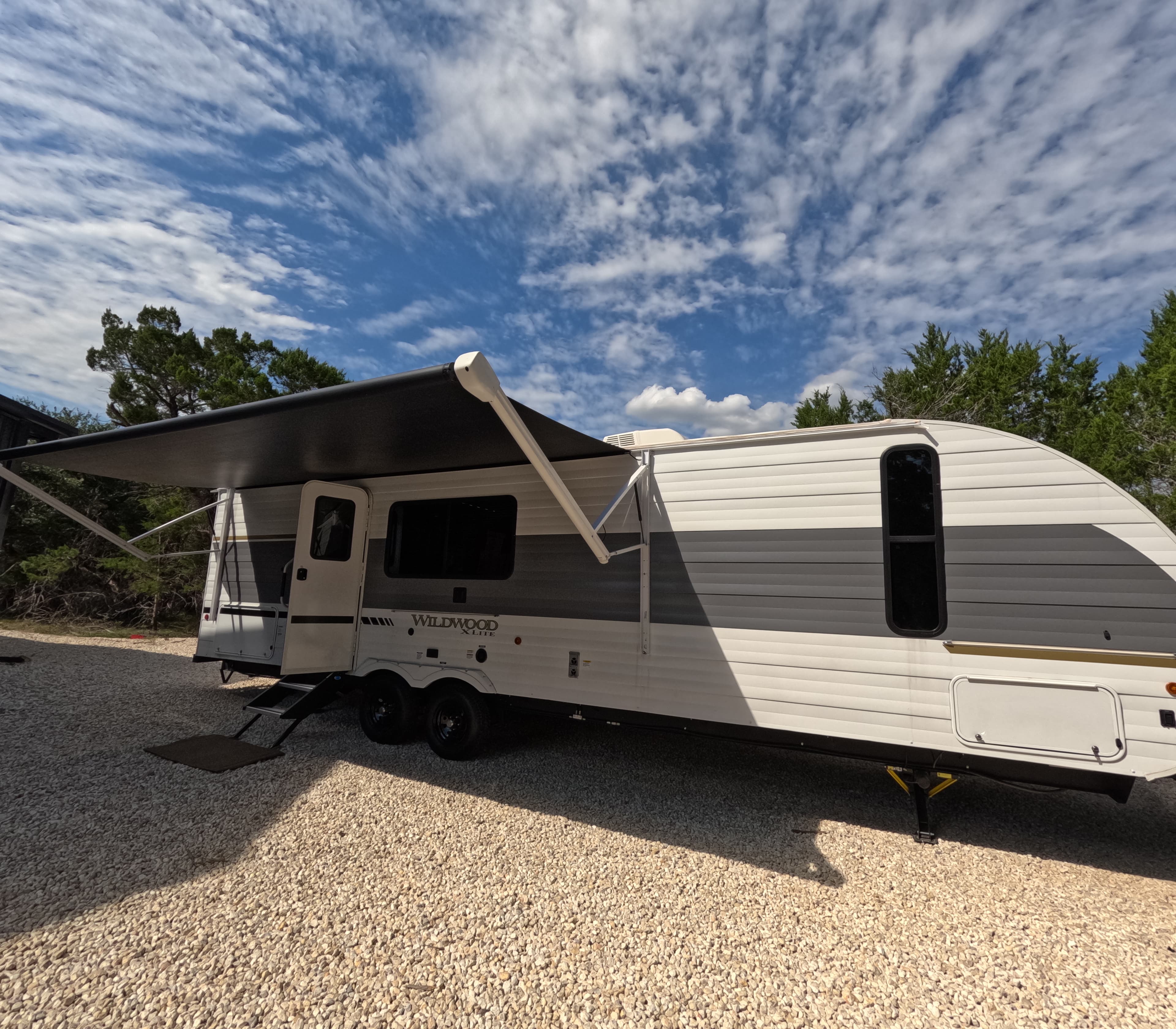 Trailer exterior under a dramatic Texas sky
