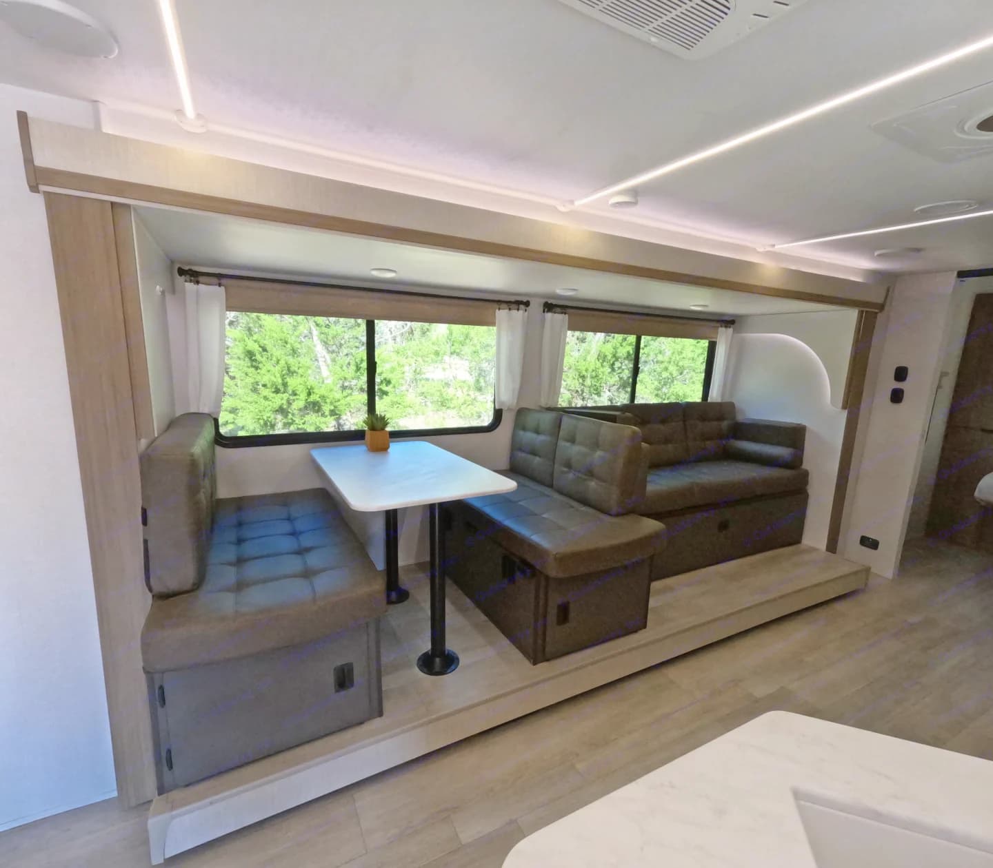 Dinette and lounge seating with large windows